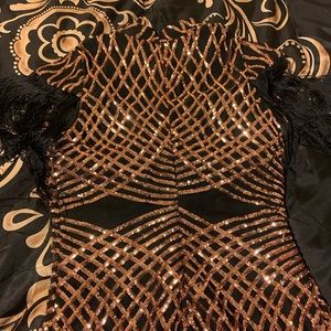 Fashion nova Black and gold sequence dress in good condition